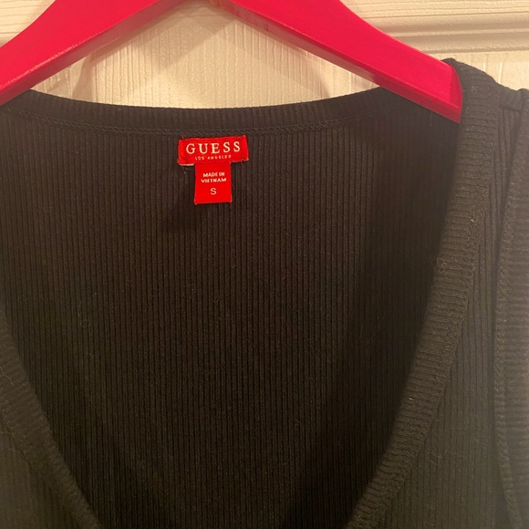 Black slightly below the knee dress by Guess with a silver chain style front. - Picture 3 of 5